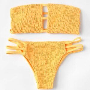 Bandeau bikini swimsuit with ladder cutouts